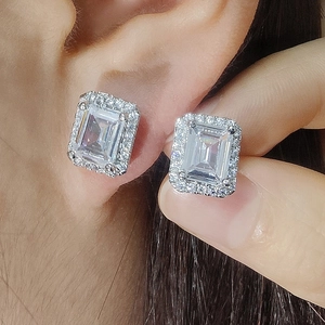 Elegant emerald-cut silver halo earrings with sparkling white cubic zirconia