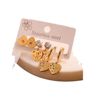 Three pairs of gold stainless steel heart earrings set with zircon and textured details