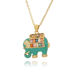 Gold elephant necklace with green enamel and colorful zircon stones on white background