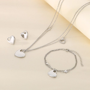Detailed set of silver-tone stainless steel heart necklace, earrings and bracelet set