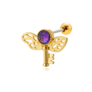 Gold winged key cartilage piercing with a purple gem and steel ball back closure