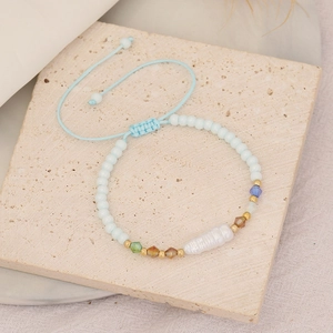 Handmade light blue woven bracelet with irregular pearl and colorful faceted beads