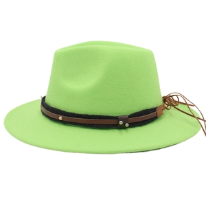 Detail of lime green felt fedora with braided rope, leather band and metal rivets