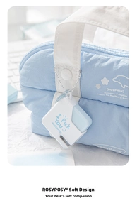 Close-up of a blue quilted stationery pouch with a portable mini stapler attachment