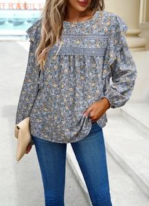 Floral blouse detail with lace拼接 and ruffles on shoulders and round neckline area