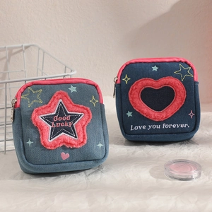 Denim square makeup bags with embroidered stars, hearts and Good Lucky slogan