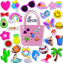 DIY pink tote bag featuring colorful silicone charms with fruits, balls and summer themes