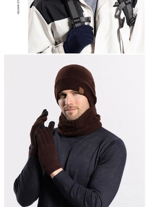 Detail of winter knit set including touchscreen gloves and hat with leather patch