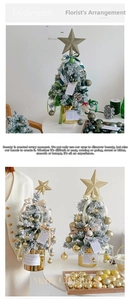 Detailed view of mini flocked Christmas tree with gold star and festive ornaments