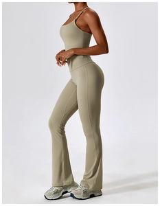 Detailed side view of high-waist flared yoga pants and racerback sports bra in olive green