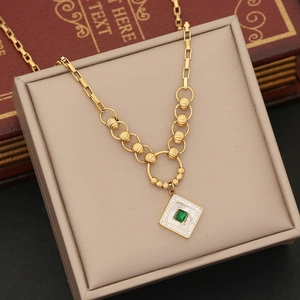 Vintage gold geometric necklace with green square gem and crystal pavé pendant