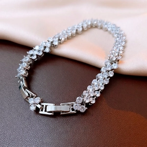 Silver-tone double-row zircon tennis bracelet with fold-over clasp on silk and leather