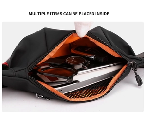 Internal view of mini waist bag showing orange lining, mesh pocket, and spacious storage