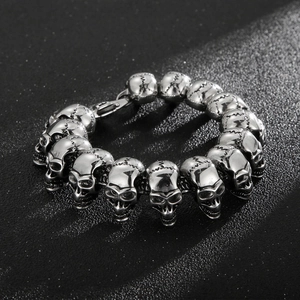 Gothic punk skull chain bracelet in silver titanium steel on a textured black background