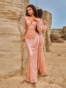 Elegant rose gold sequin evening gown with deep V-neck and side cutouts shown in mirror view