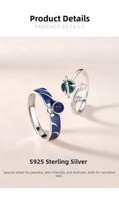 Detail of S925 sterling silver astronaut rings with blue enamel and starry star patterns