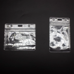 Close-up of clear plastic ID card holders in horizontal and vertical designs