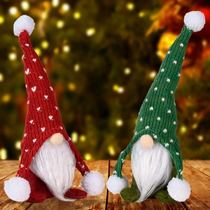 Christmas gnomes set with knitted hats and white beards on warm wooden surface