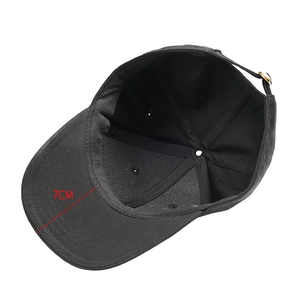 Detailed top view of black cotton baseball cap interior showing 7cm brim measurement info