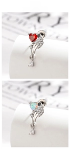 Detailed close-up of heart-shaped wing earrings with zircon inlay and water drop pendant