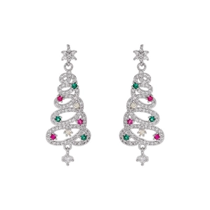 Detail view of silver Christmas tree earrings with colorful tassels and sparkling zircons