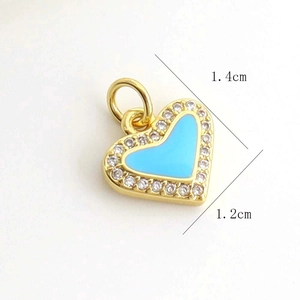 Detail view of heart pendant with blue enamel, crystals and 1.4x1.2cm dimension
