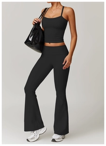 Detail of black cross-back yoga tank top and high-waist flared leggings set