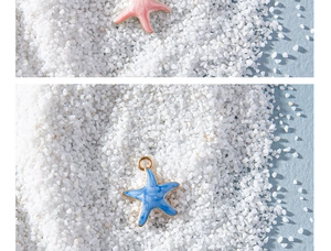 Detailed view of colorful starfish charms in pink and blue enamel on fine white sand