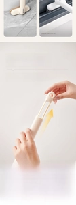 Detail showing multifunctional crevice brush with built-in tweezers for hair and debris removal