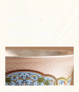 Detail showing traditional Chinese silver filigree with colorful enamel floral patterns