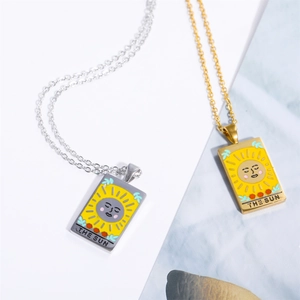 Gold and silver stainless steel tarot necklaces featuring sun design with enamel detail