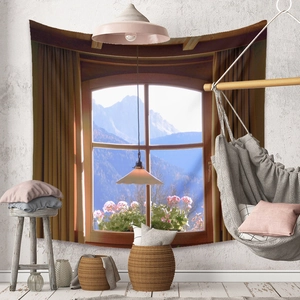 Detail of bohemian tapestry with a window view of distant mountains and pink flowers
