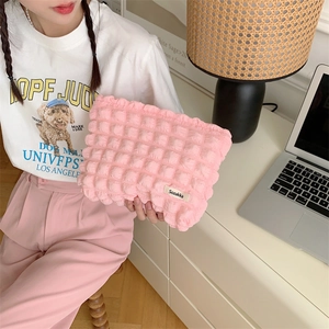 Pink quilted puffer makeup bag made of durable canvas for travel and daily storage
