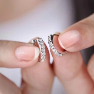 Exquisite silver hoop earrings with a single row of sparkling white cubic zirconia stones
