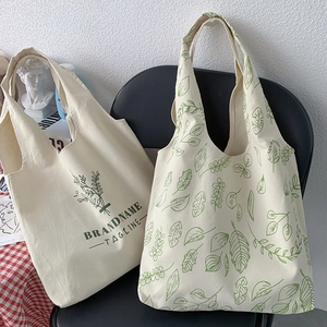 Minimalist canvas tote bag with plant prints and reinforced stitching detail
