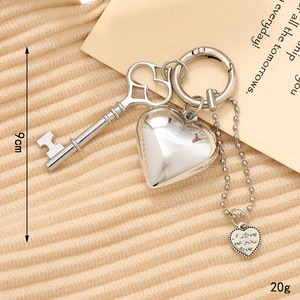 Silver heart key pendant with 'I love you' tag and ball chain accessory for bags