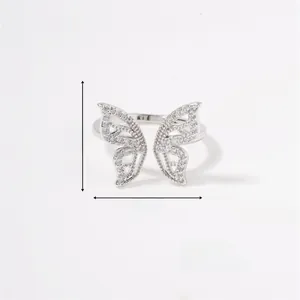 Detailed view of butterfly open ring with dimensions 1.5cm by 1.7cm and zircon inlay