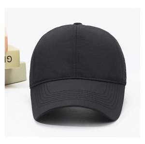 Detail view of quick-dry black baseball cap featuring laser-cut ventilation holes