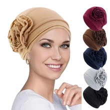 Detail view of twist braid turban hat with flower accent and multi-color swatches