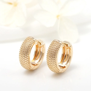 Minimalist 18k gold plated hoop earrings with embossed bead texture on white background