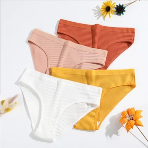 Détails de culottes en coton côtelé colorées en blanc jaune rose et orange vif