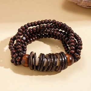Detail of multi-layer wood bead bracelet featuring coconut shell and vintage ethnic design