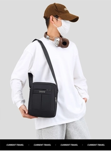 Asian male model wearing a black waterproof crossbody bag with adjustable fabric strap