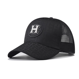 Black trucker hat with silver 3D H embroidery and jacquard pattern on a white background