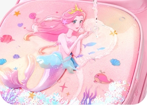 Detail of pink waterproof school bag featuring 3D embossed mermaid design for girls