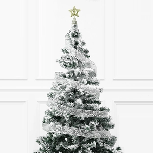 Detail of Christmas tree with LED glowing ribbon and golden star tree topper decoration