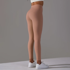 Close-up of high-waist yoga leggings in soft pink with lifting and sculpting effect