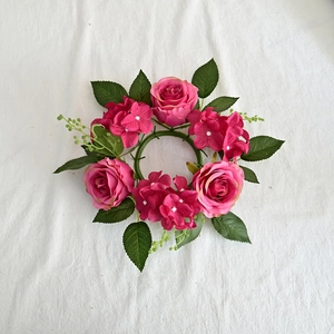 Top view of a 20cm artificial rose and hydrangea candle ring wreath in pink and green