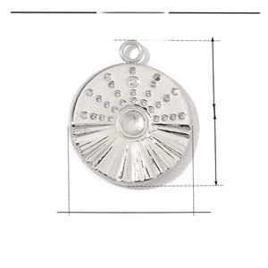 Macro detail of a 15mm lucky clover compass pendant in polished stainless steel
