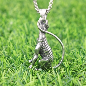 Silver vintage Egyptian sphinx pendant necklace in stainless steel on green grass